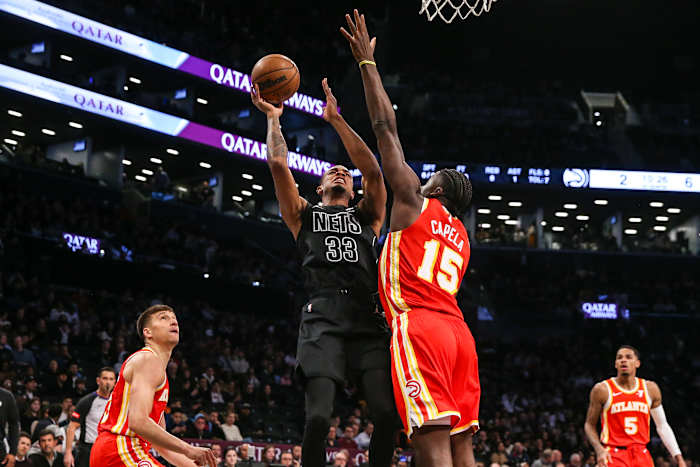 Feb 29, 2024; Brooklyn, New York, USA; Brooklyn Nets center Nic Claxton (33) moves to the basket against Atlanta Hawks center Clint Capela (15) in the first quarter at Barclays Center. Mandatory Credit: Wendell Cruz-USA TODAY Sports